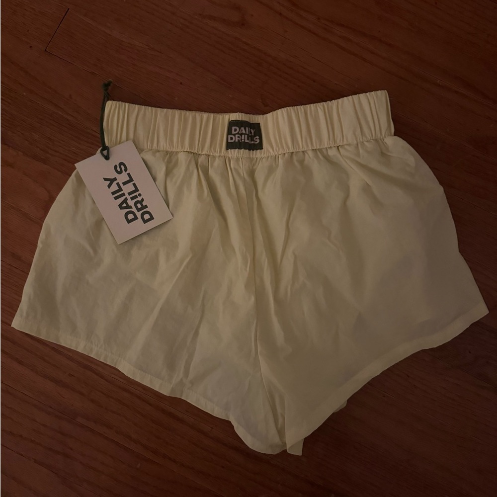 NWT Daily Drills yellow shorts